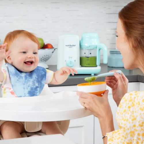 NB_Baby_Steam-Blend_Lifestyle_Mom-Baby_Eating-Puree_HiRes-scaled